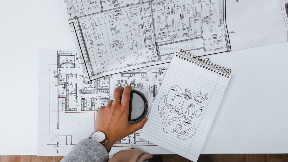 Reviewing floor plans and take-off notes on a drawing set