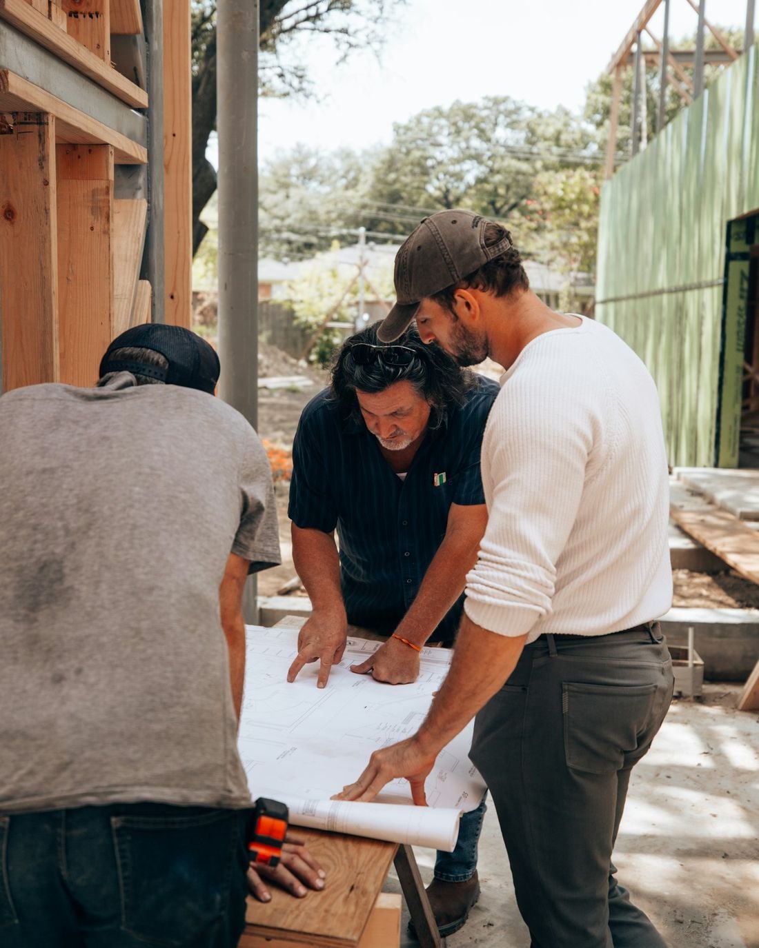 A contractor team reviewing drawings together on site